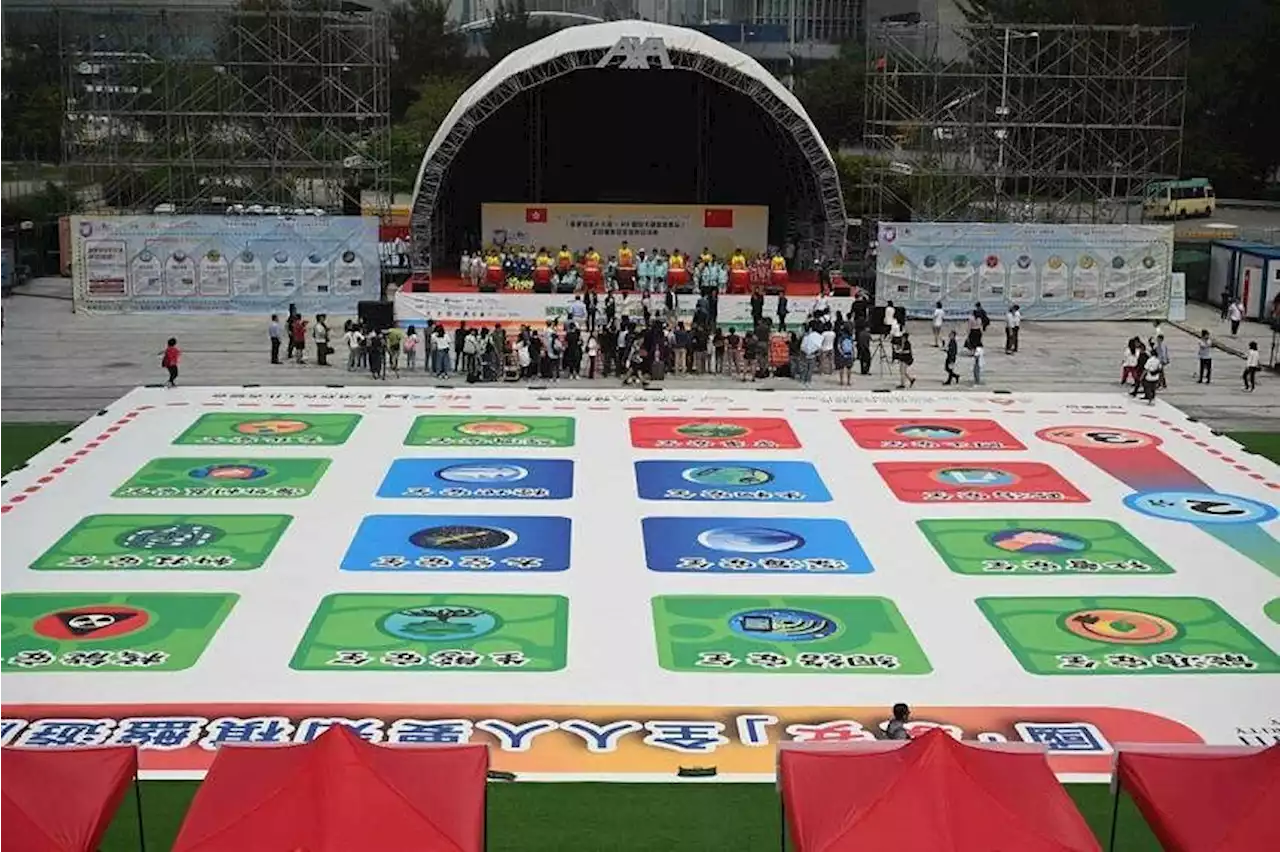 Hong Kong tries to show fun side of national security with giant board game