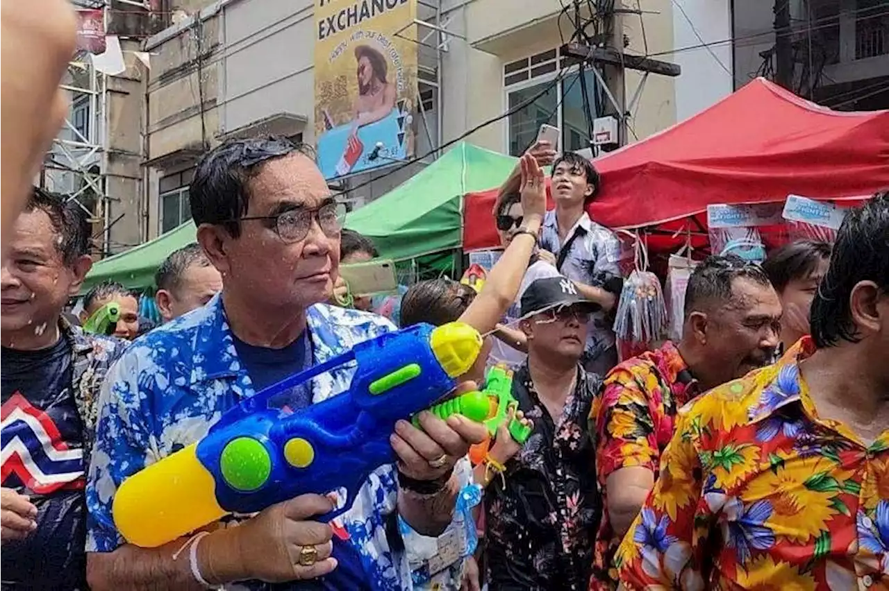 Thai PM Prayut gets a drenching in surprise water fight appearance