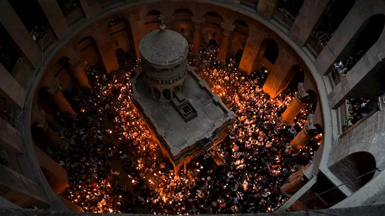 Christian faithful celebrate Holy Fire ceremony as Israeli police clash with worshippers over crowd limits