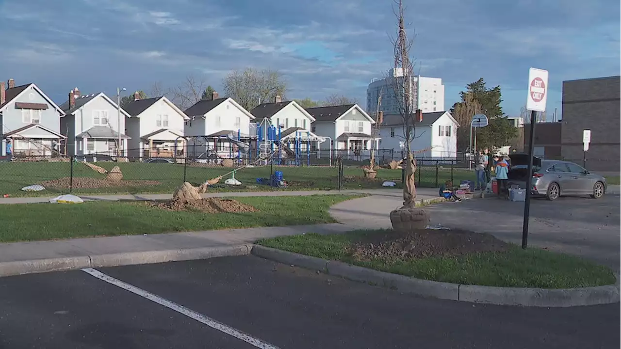 Community members plant trees at south Columbus school ahead of Earth Day