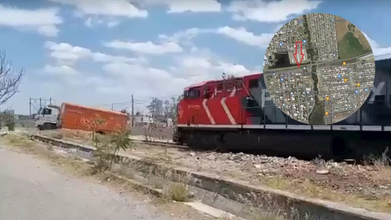 ¡Aguas, aguas!: tren se lleva un camión de Bonafont (VIDEO)