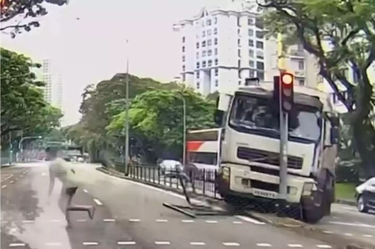 Garbage truck loses control in Havelock area, toppling traffic light and almost hitting pedestrian