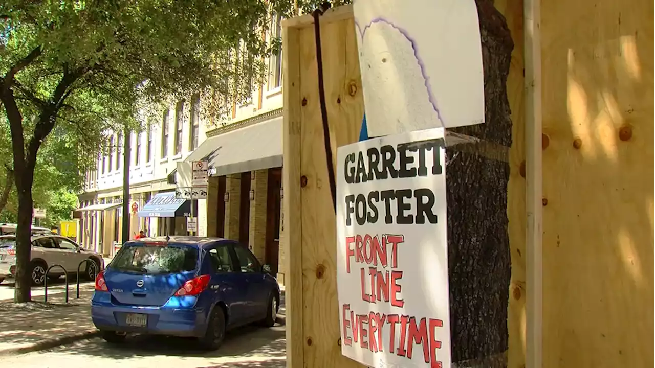 Friends, family re-build downtown memorial for Garrett Foster following trial