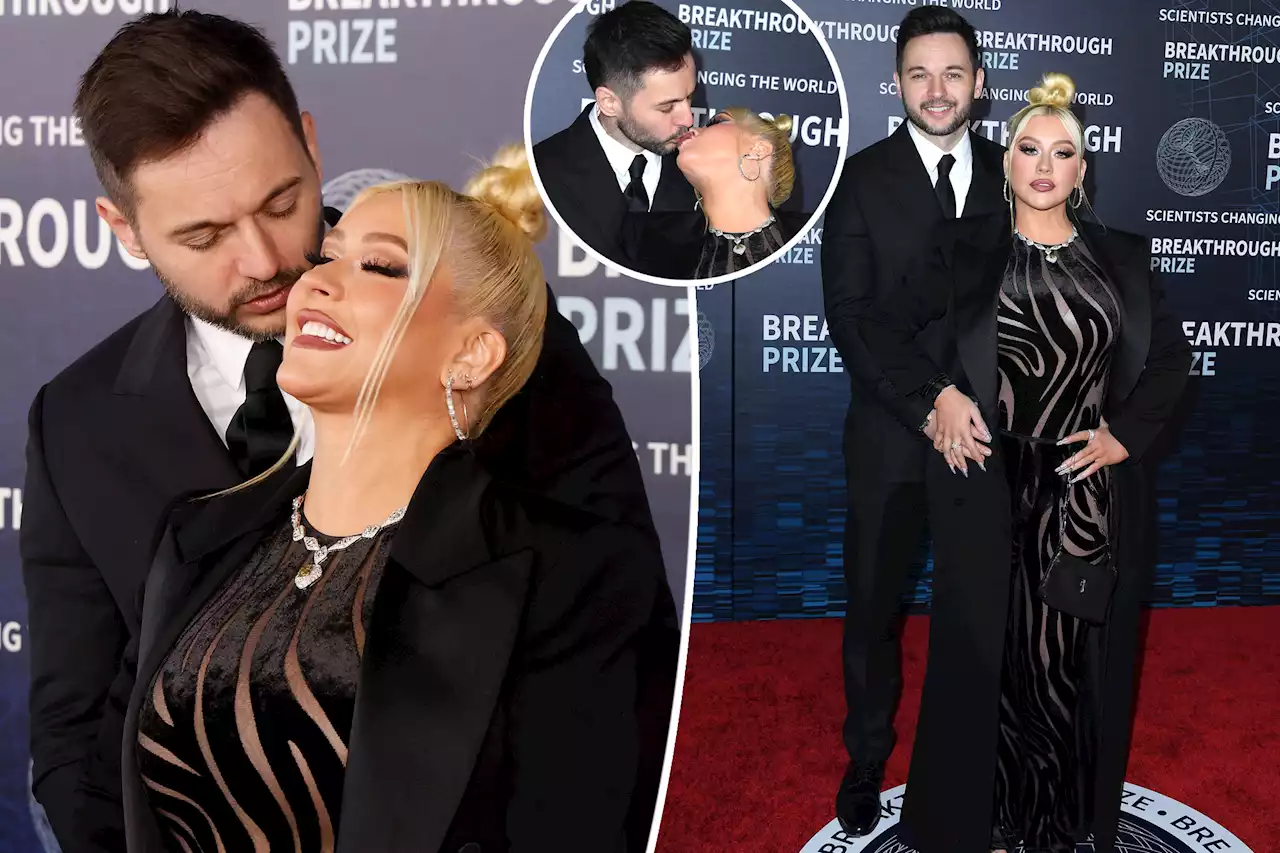 Christina Aguilera smolders in sheer zebra stripes on red carpet with Matthew Rutler