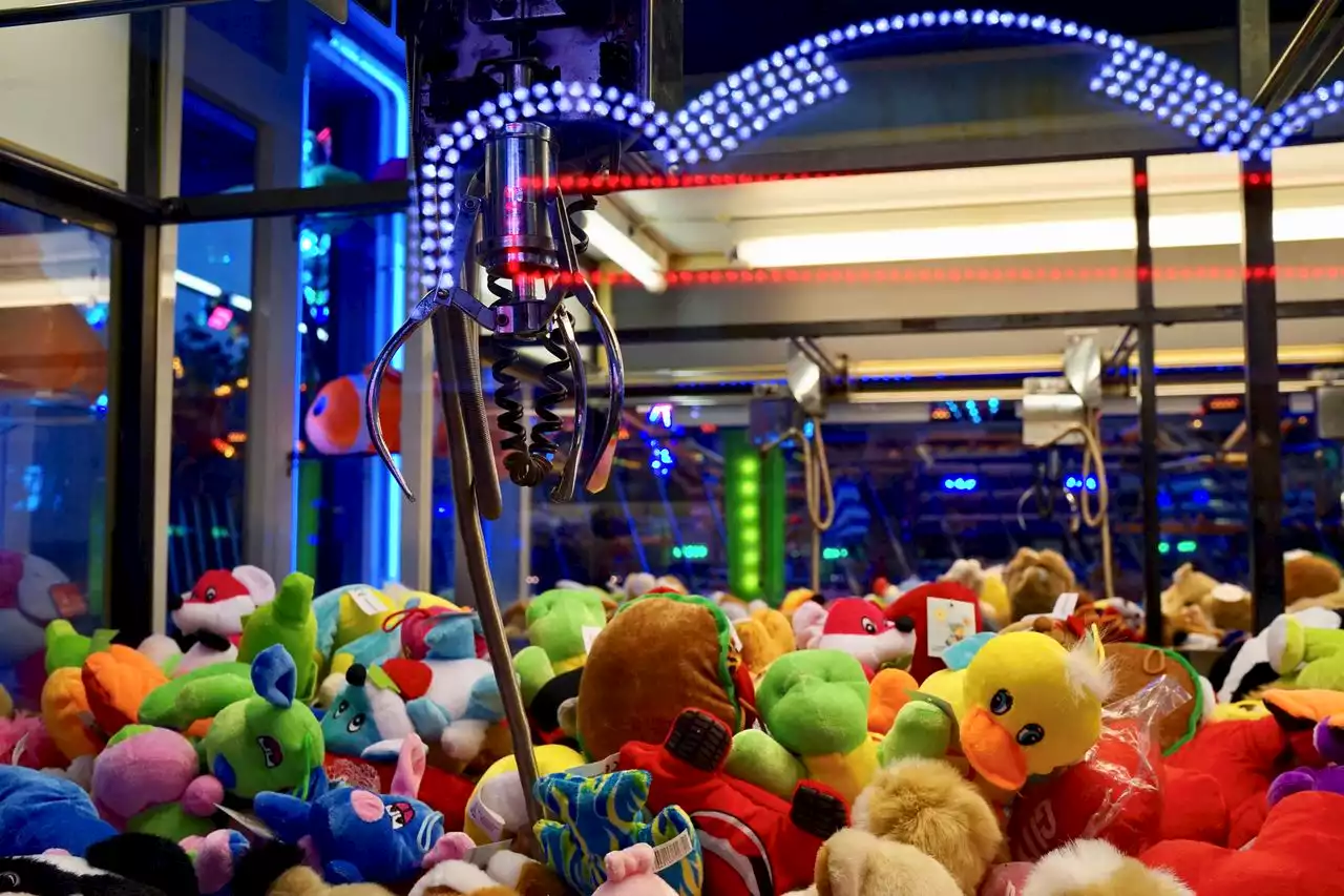 Teen boy gets stuck climbing into claw machine for prize