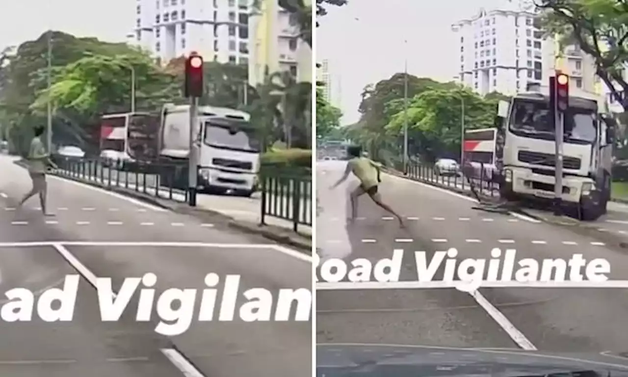 Woman crossing road runs away when she sees garbage truck hurtling towards her