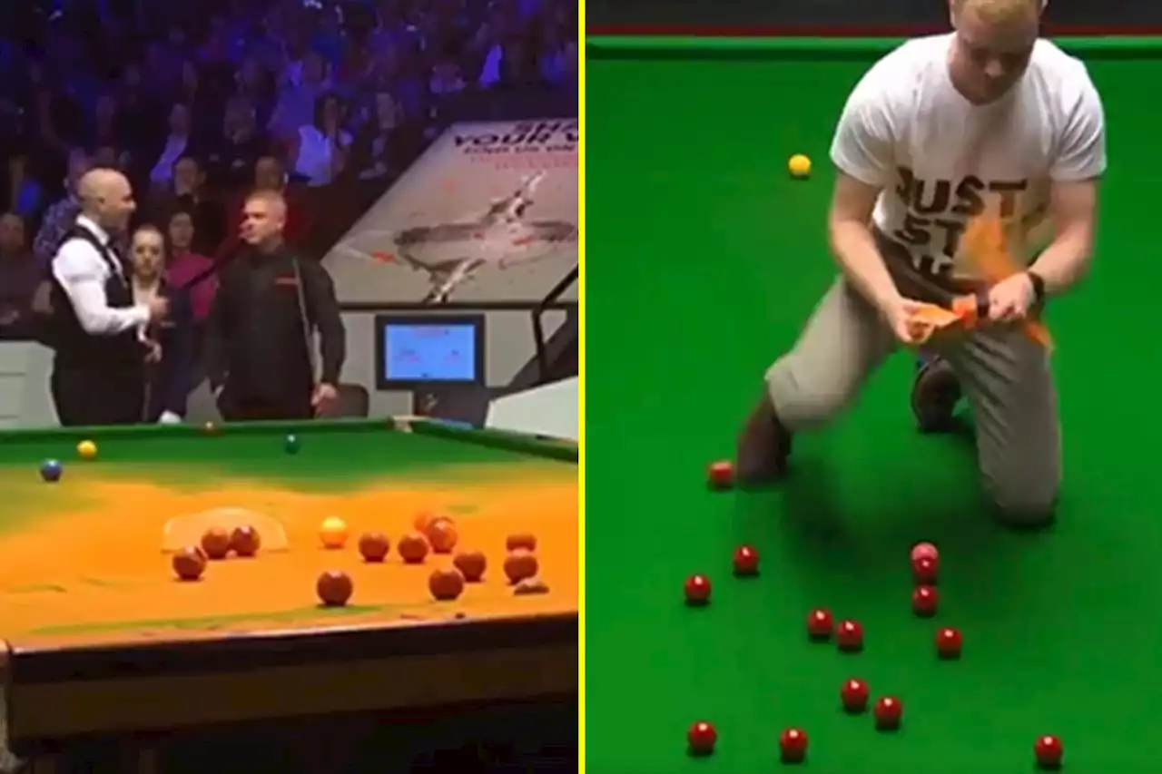 Just Stop Oil protester jumps on snooker table and covers it in orange powder at Crucible