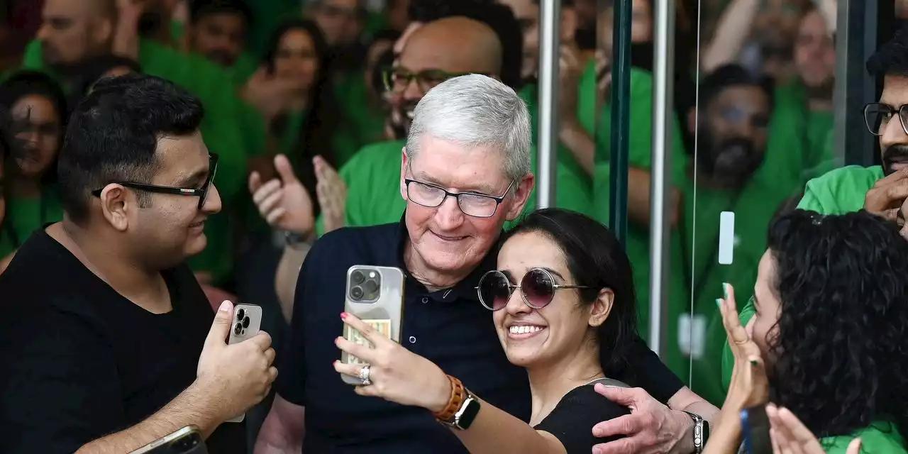 Apple opens flagship store in India as Tim Cook greeted by fans and an old Macintosh