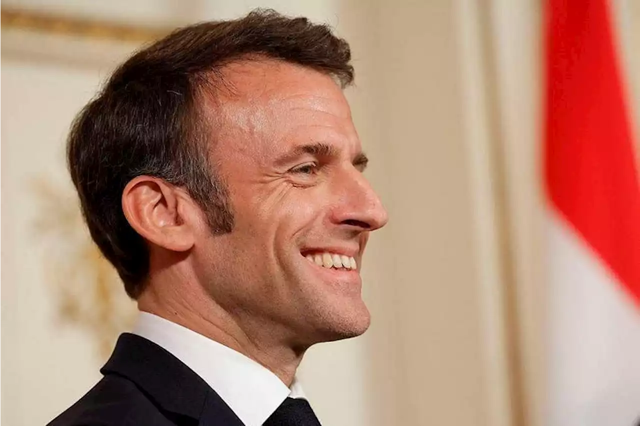 Macron seen singing in the streets after pensions address