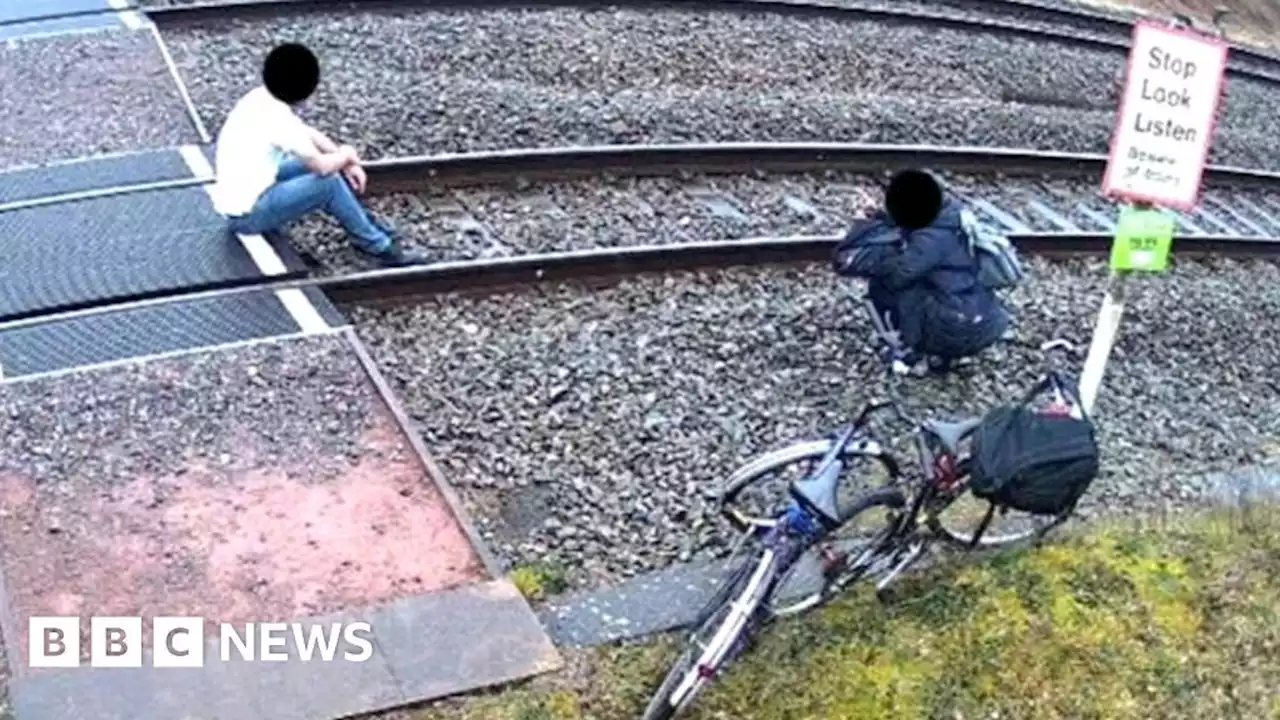 Pair taking picture on railway line 'risking their lives'