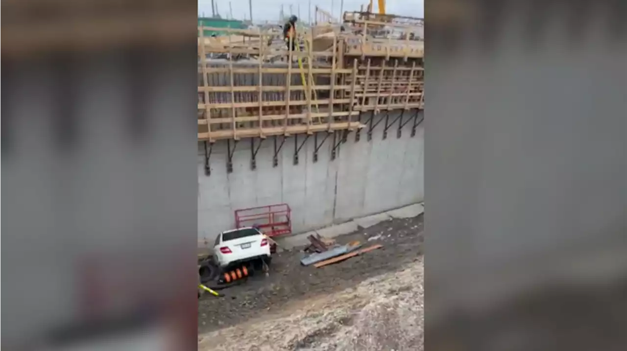 Two injured after vehicle drove into construction pit next to QEW in Mississauga