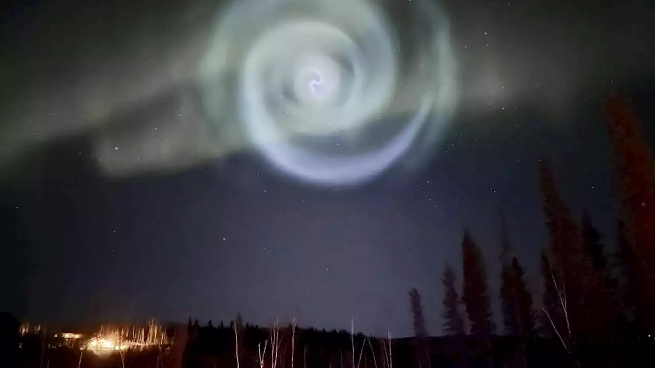 Odd spiral appears amid northern lights in Alaska night sky