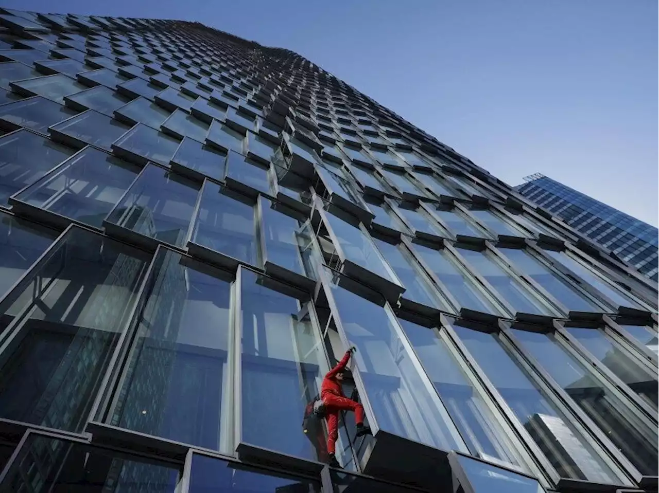 'French Spiderman' shows his support for protesters by scaling 38-story Paris skyscraper