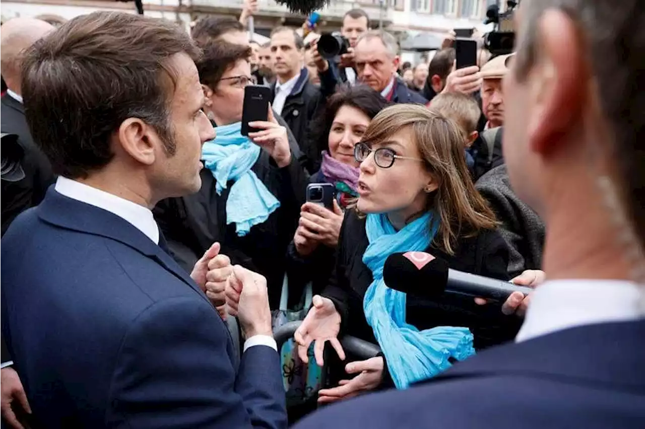 Macron booed by angry French after signing pensions reform