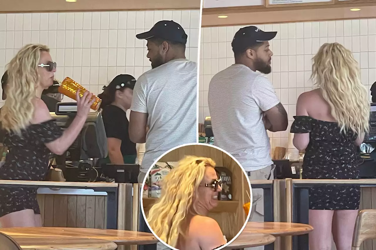 Britney Spears seen with mystery man on vacation after ditching wedding ring