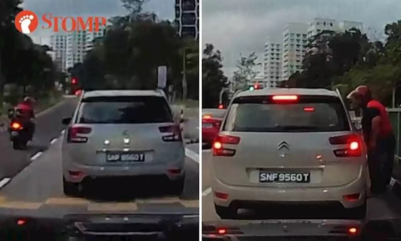 Motorcyclist confronts car driver in middle of road in Bukit Panjang and allegedly spits at driver