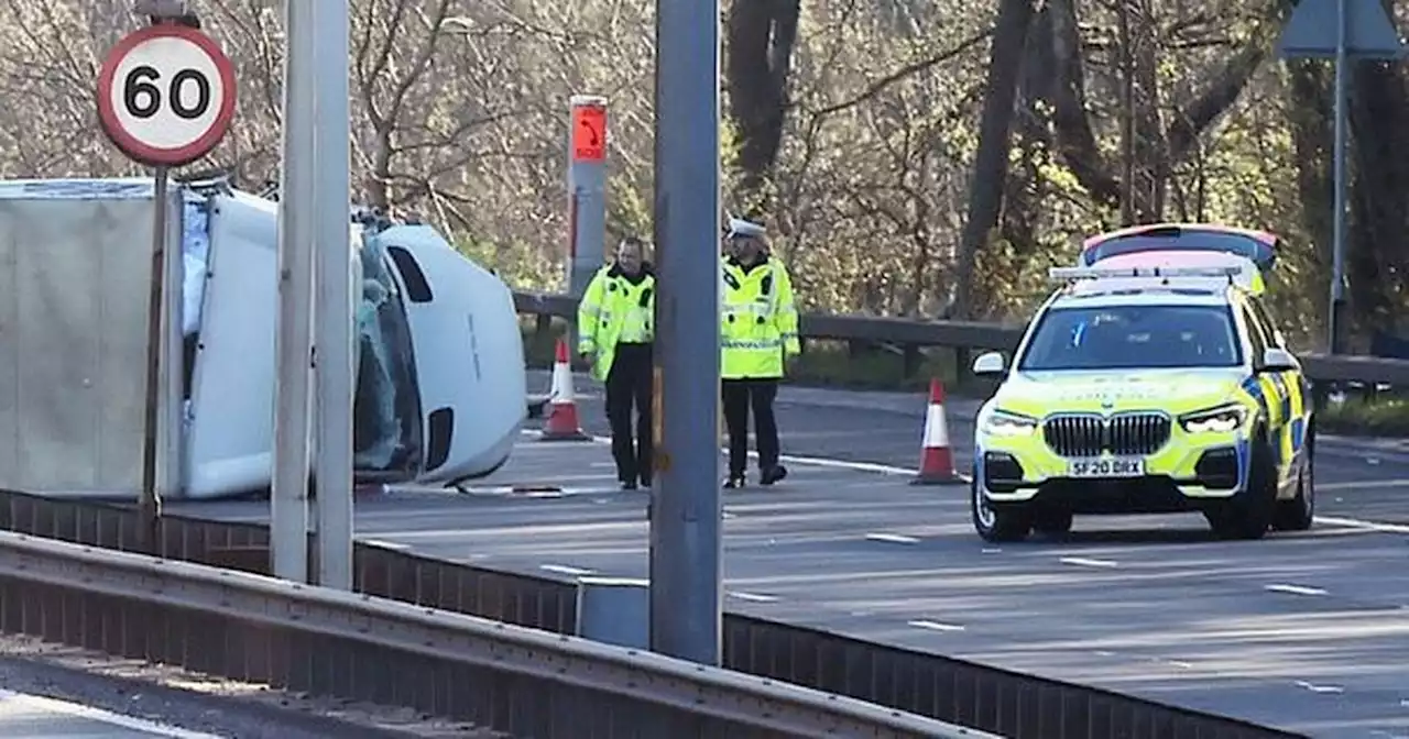 Two rushed to hospital after Glasgow M8 crash as lorry overturns on motorway