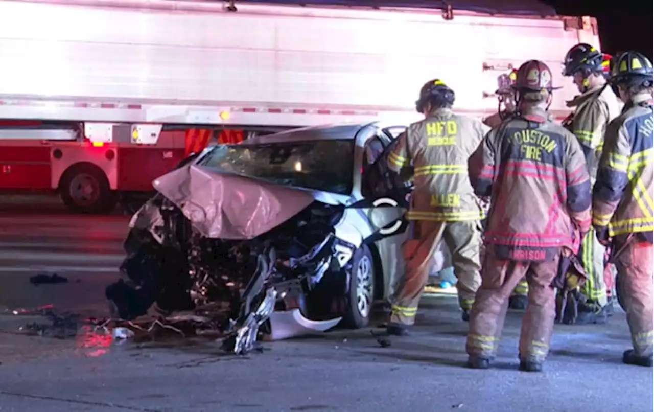 Authorities extricate woman from vehicle after crash involving big rig in northeast Houston