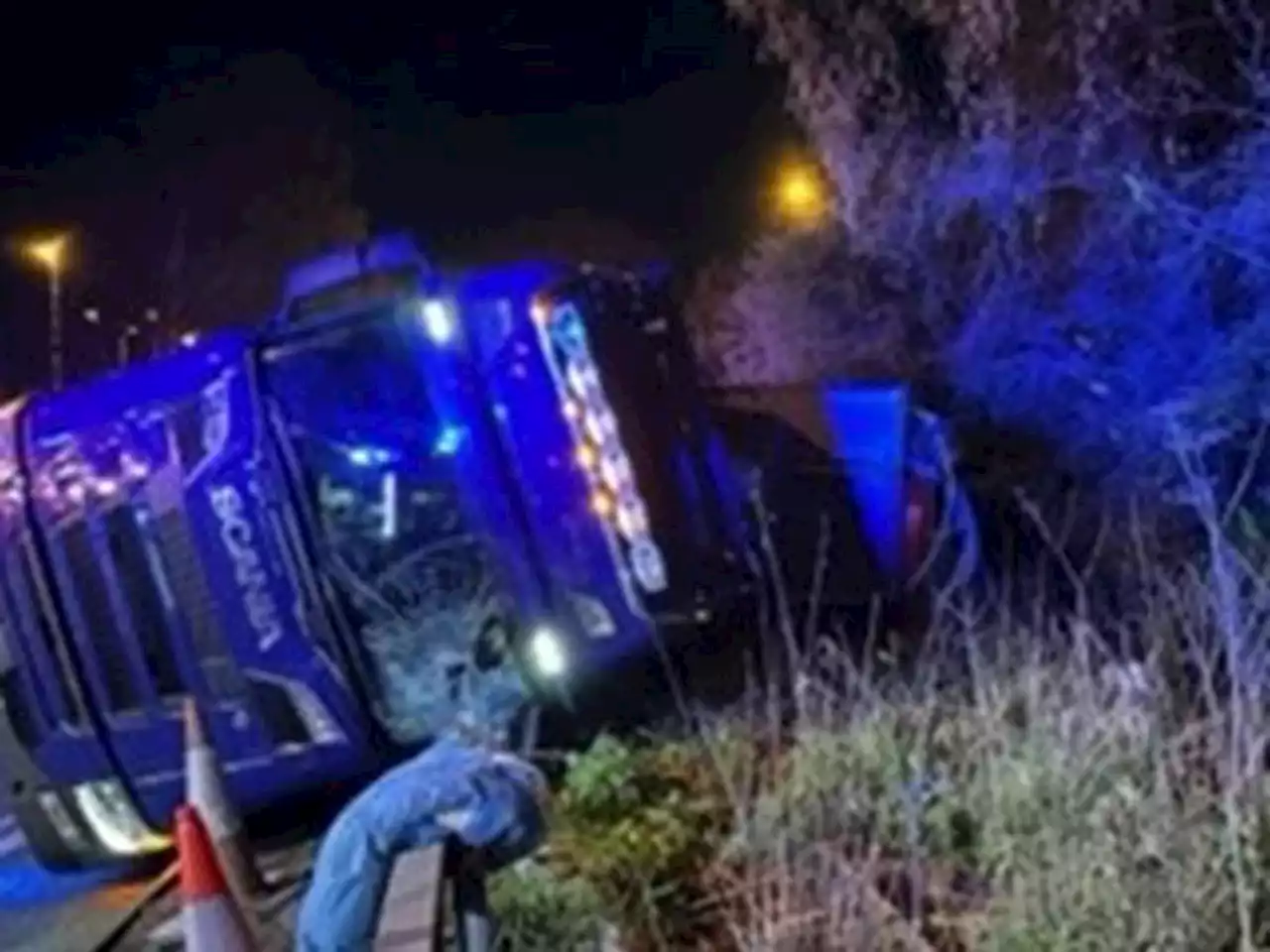 Overturned lorry blocks junction as police incident stops traffic in busy night on M6