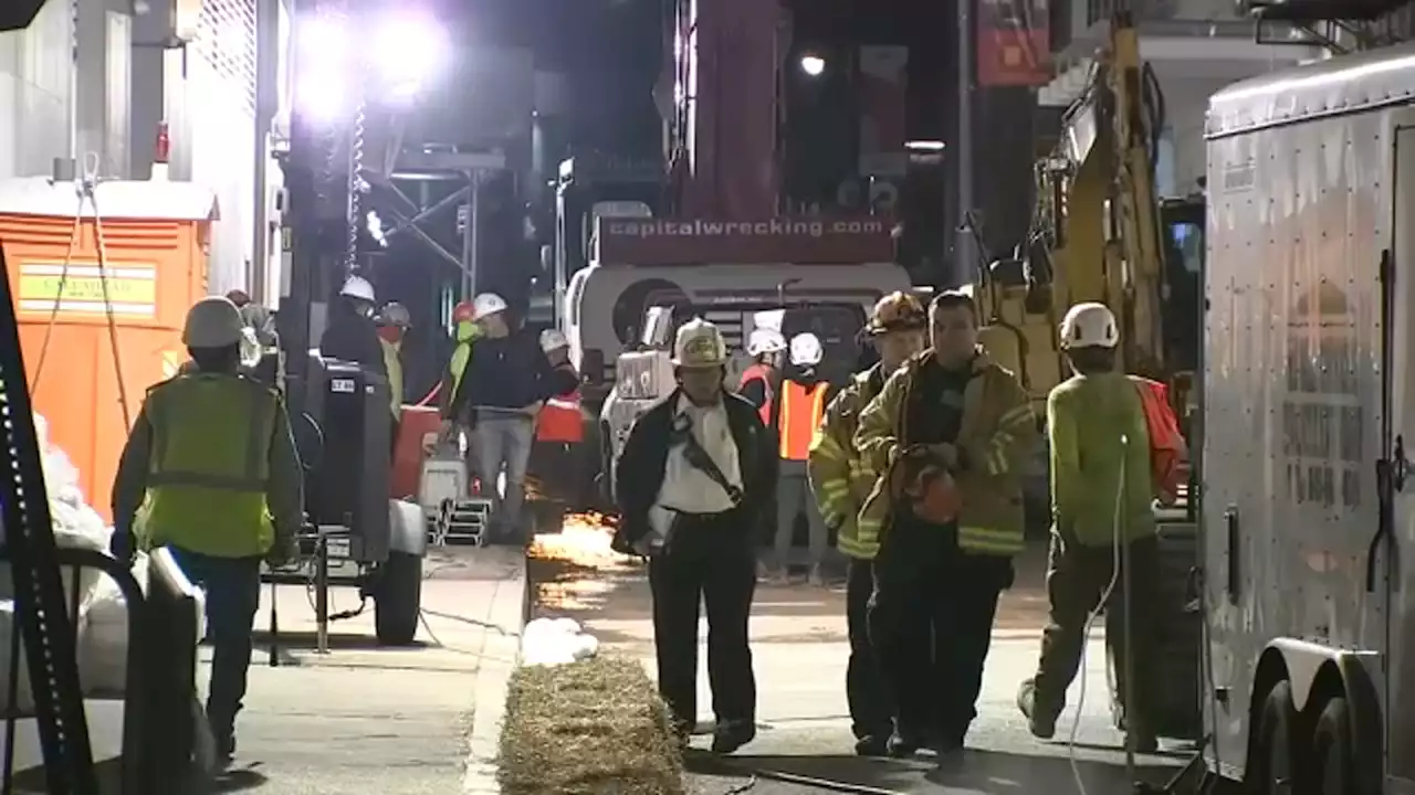 Inspectors wait for debris to be cleared to assess collapsed garage in Lower Manhattan