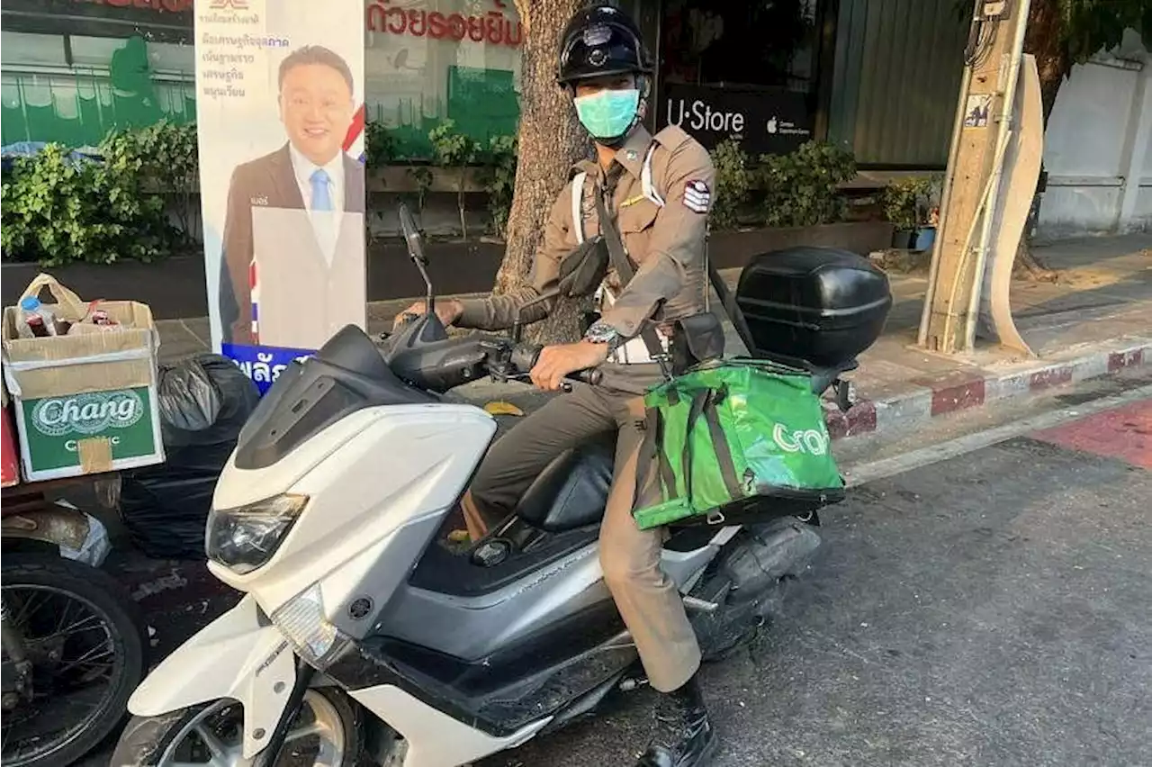 Thai policeman delivers Grab order on behalf of rider who faints and crashes his bike