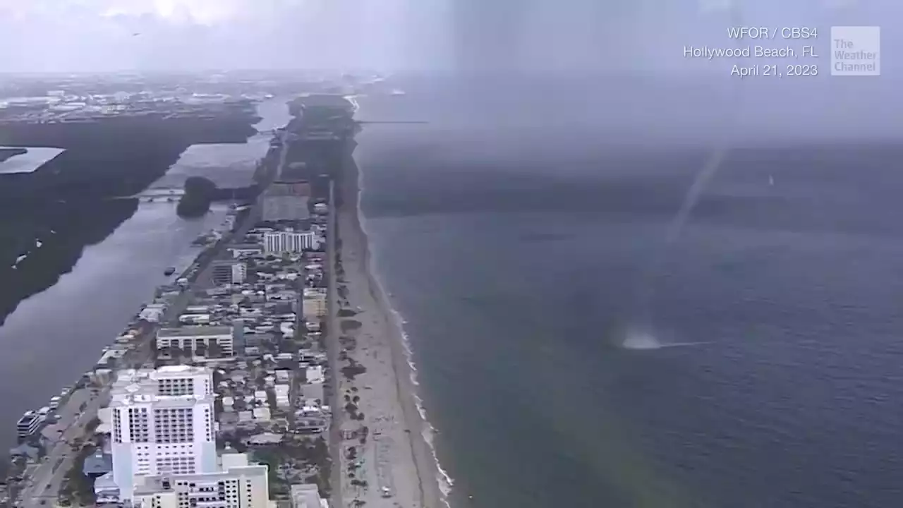 Waterspout Comes Ashore, Panicked Beachgoers Scramble - Videos from The Weather Channel