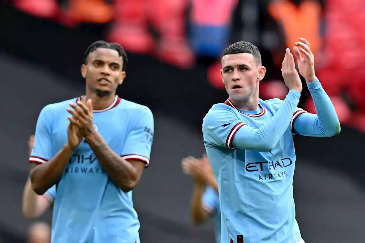 Man City beats Sheff United to keep treble dream alive