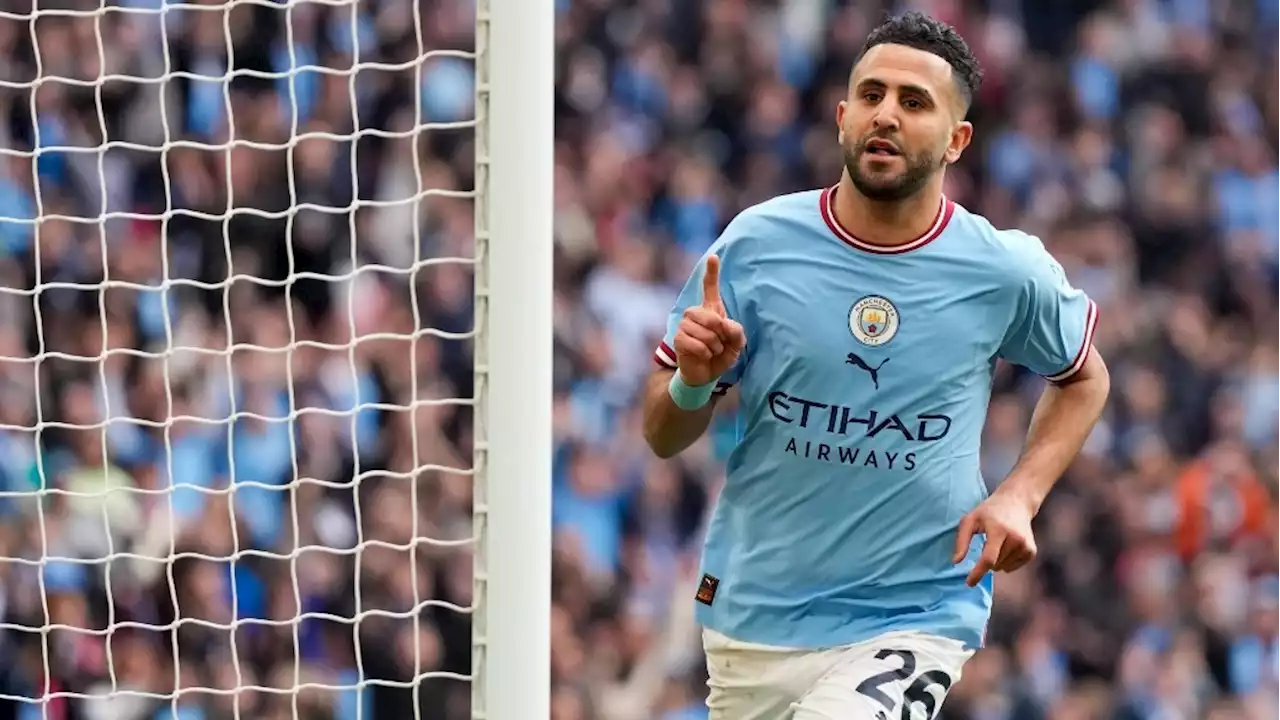 Man City beats Sheff United to keep treble dream alive