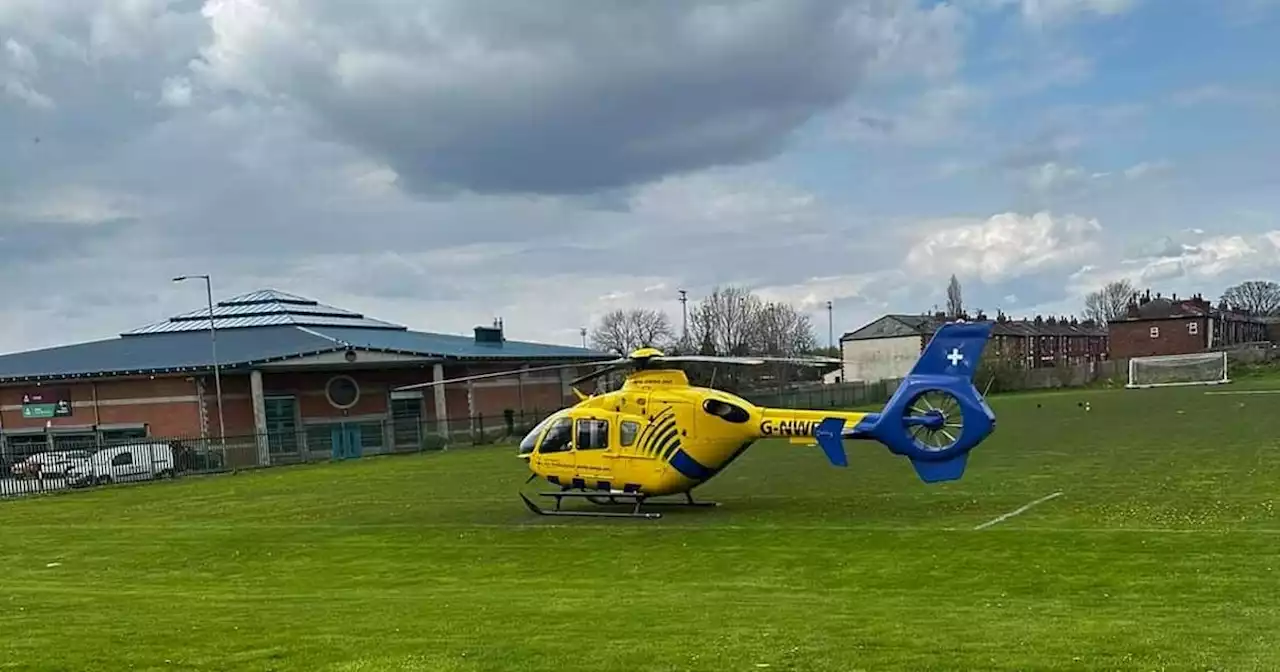 Air ambulance lands as police block street amid reports person seriously injured