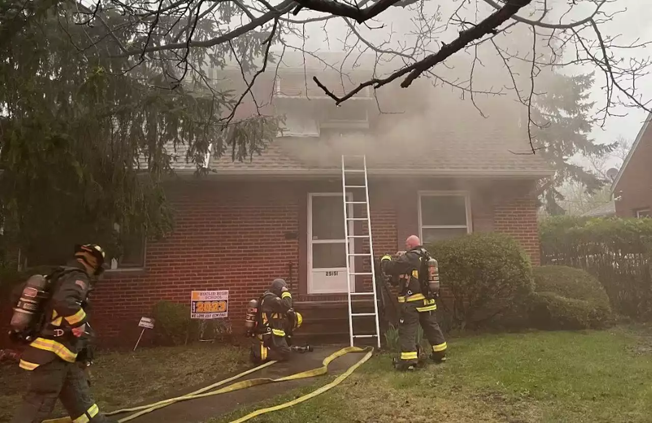 Euclid firefighters rescue woman from roof of burning home