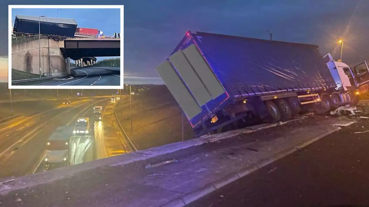 Miles of congestion on M1 after crash left lorry hanging precariously off bridge above A14