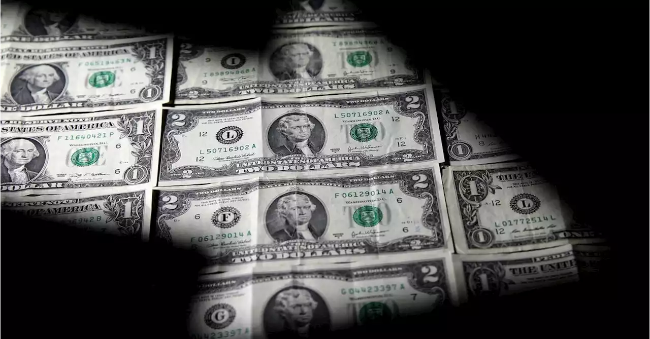 Dollar edges lower; on track for second straight monthly loss