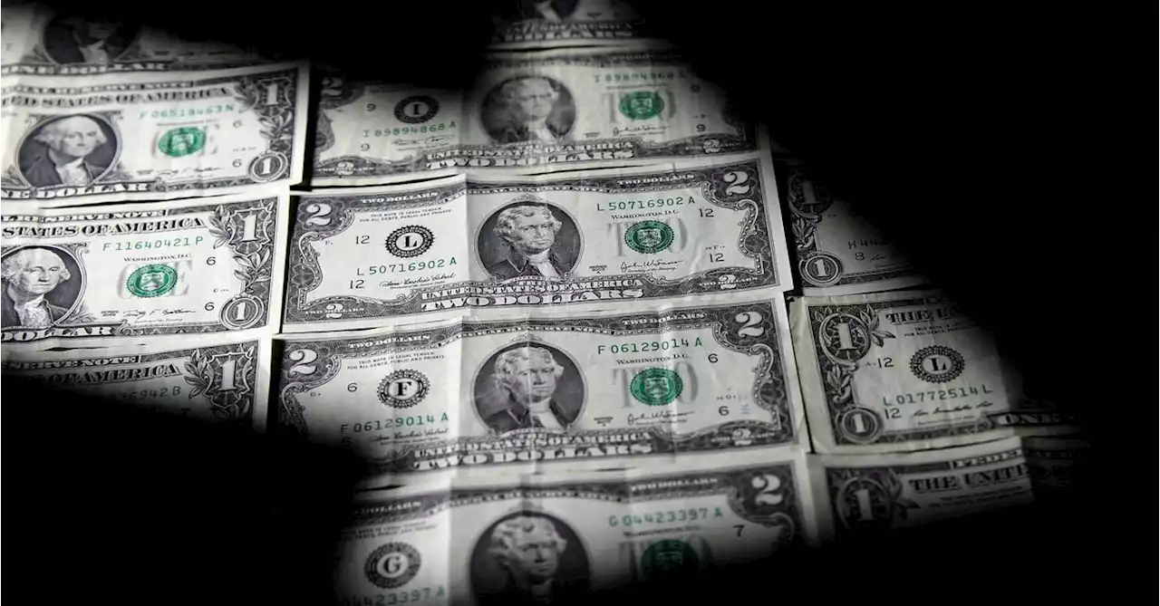 Dollar gains, on track for second straight monthly loss