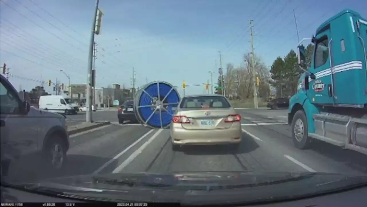 Giant spool of cable rolls down Yonge St.