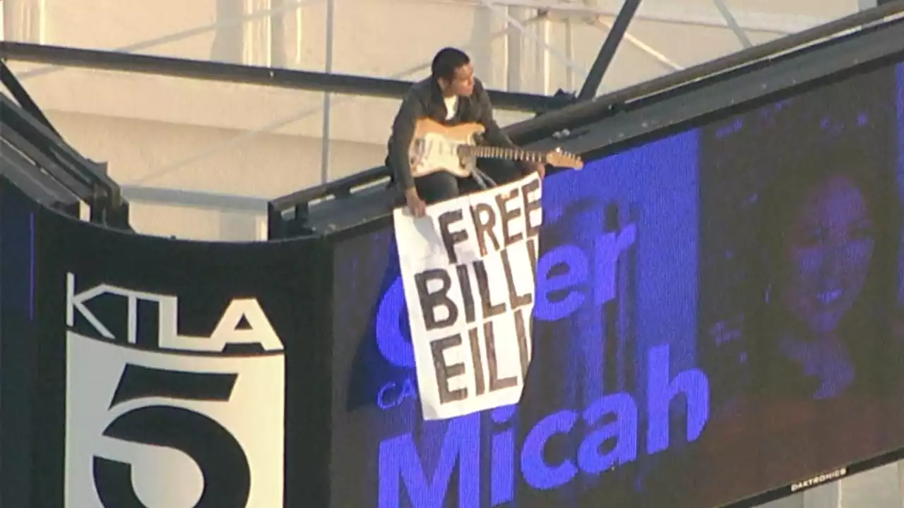 Man climbs up KTLA tower in Hollywood holding 'Free Billie Eilish' sign, remains for several hours