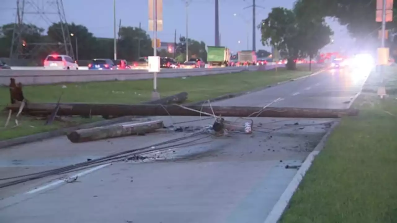 Driver crashes into several live power poles, toppling lines in southwest Houston