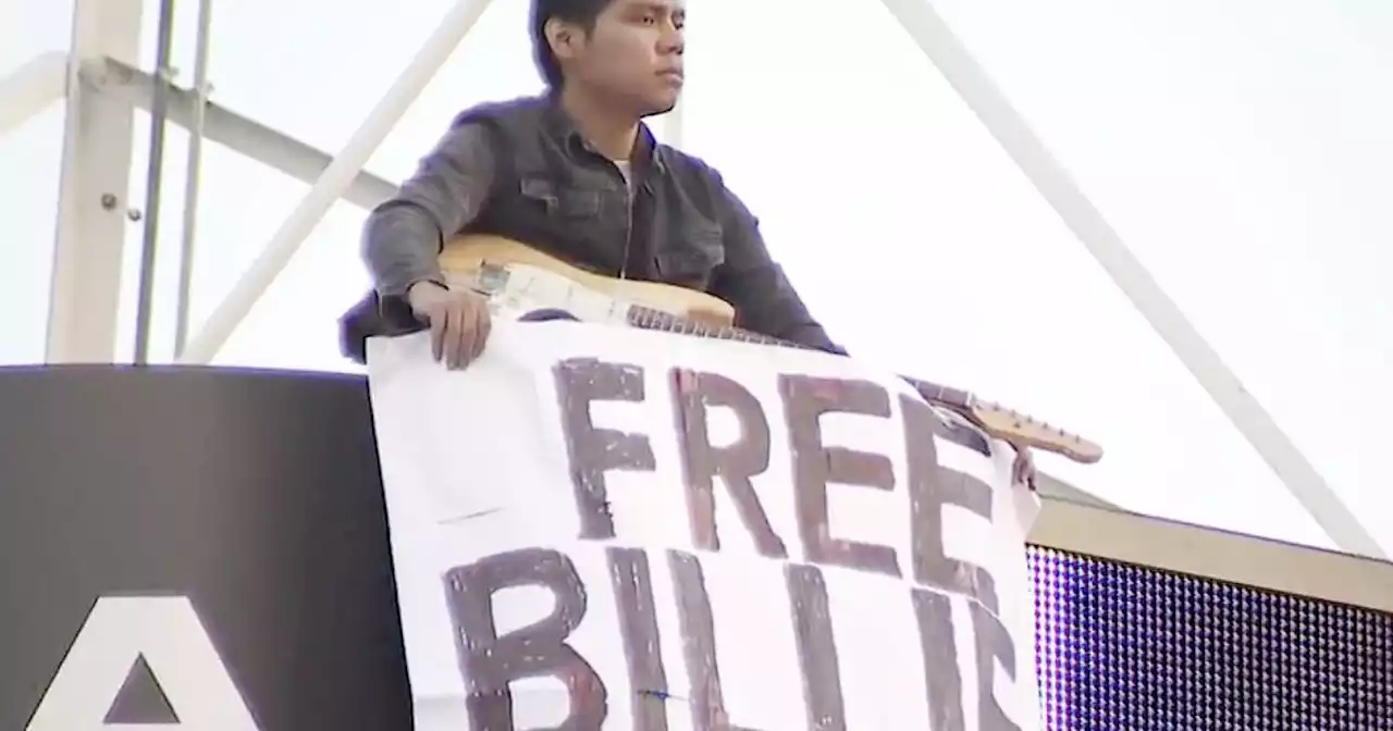 Man holding 'Free Billie Eilish' sign climbs KTLA tower in Hollywood