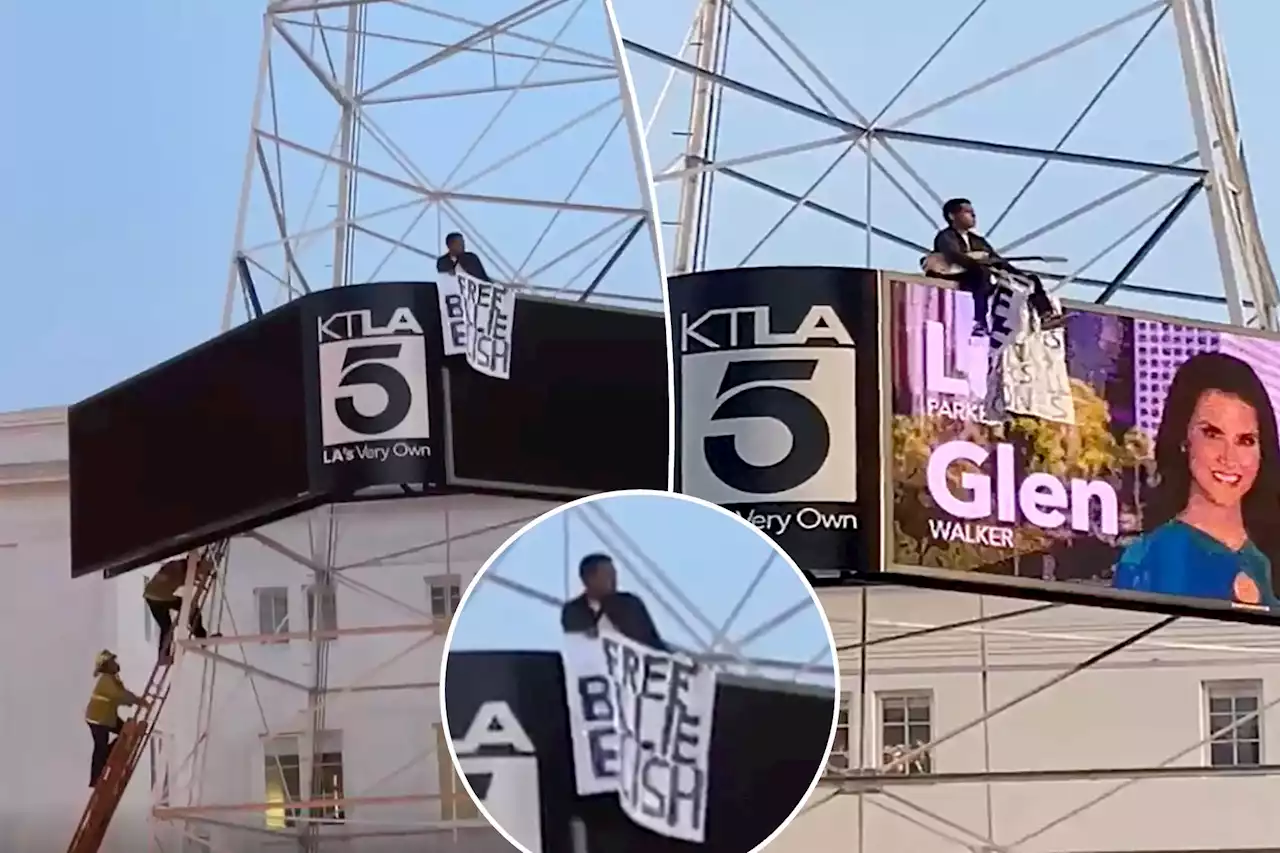 Man scales California news tower, waves ‘Free Billie Eilish’ sign