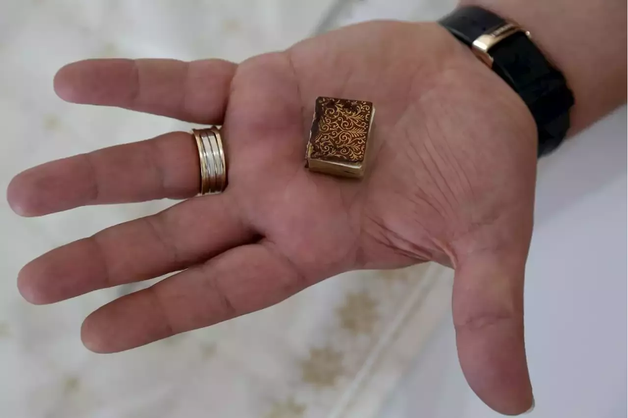 Albanian family holds tight to tiny Quran