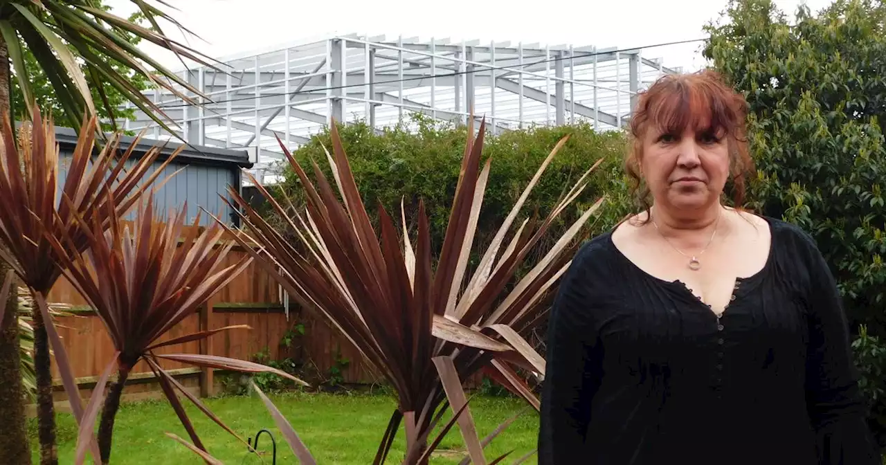 Woman frustrated as Lidl and Wickes stores tower over her garden