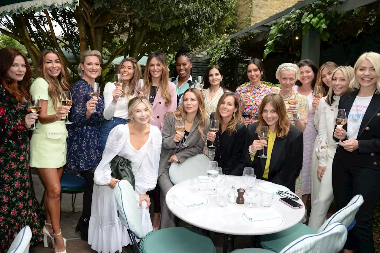 Holly Willoughby and Christine Lampard giggle over glass of wine at chic lunch