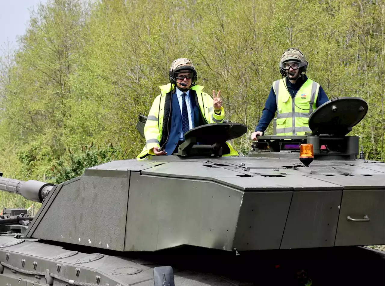 Ukrainian ambassador rides in a tank during visit to region