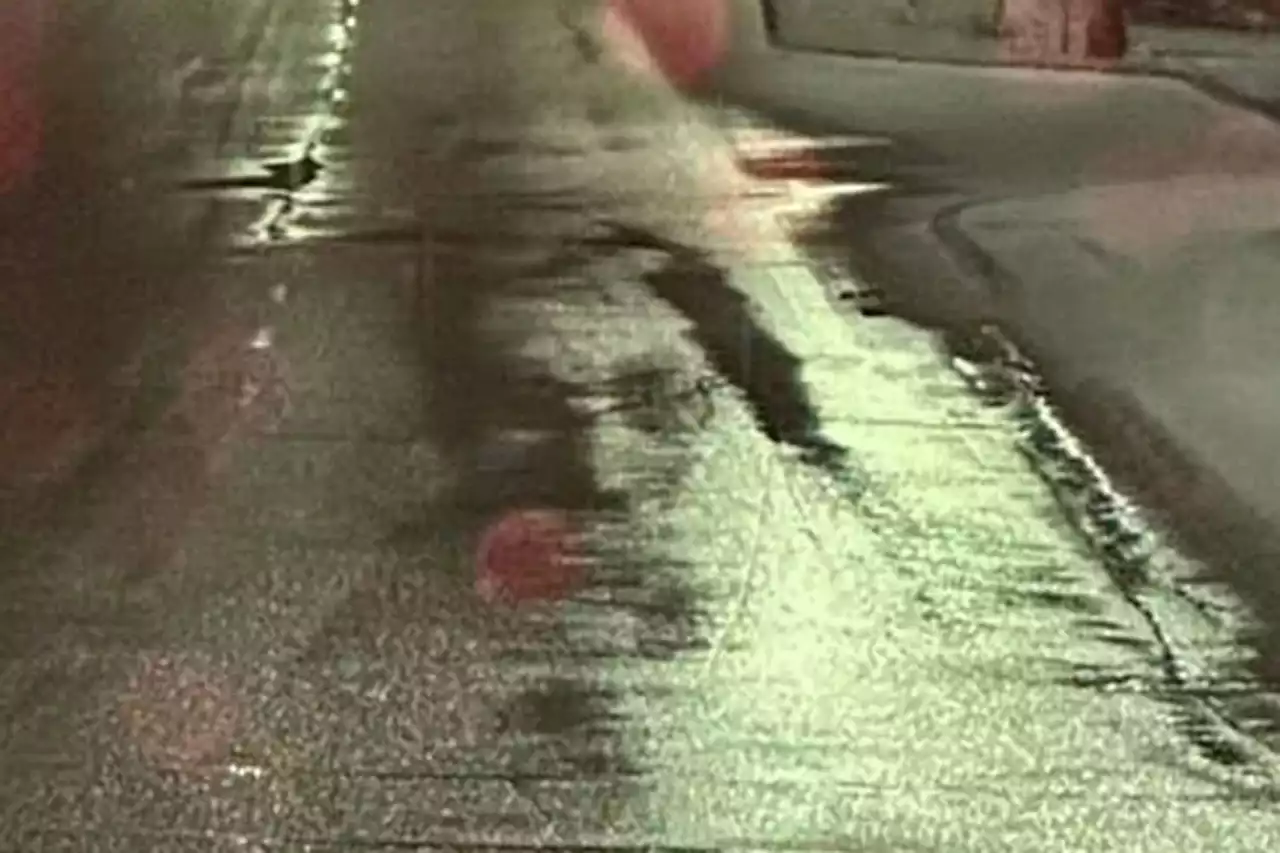 Incredible moment driver spots face of The Beatles legend John Lennon in a puddle