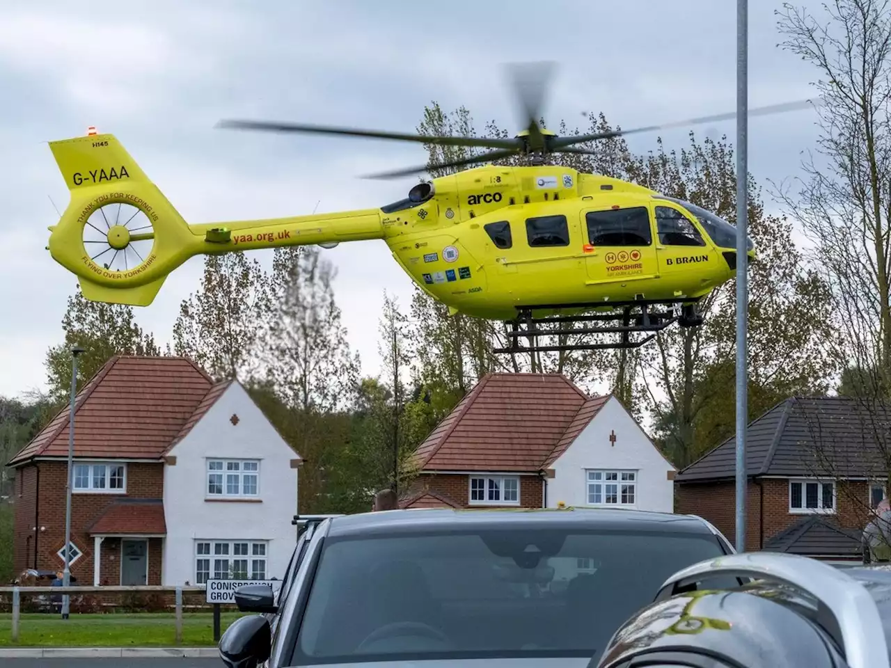 Pictures show air ambulance landing at Leeds housing estate as police at scene of incident