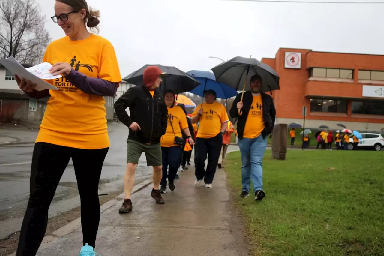 More than 100 marchers brave the rain for safer workplaces