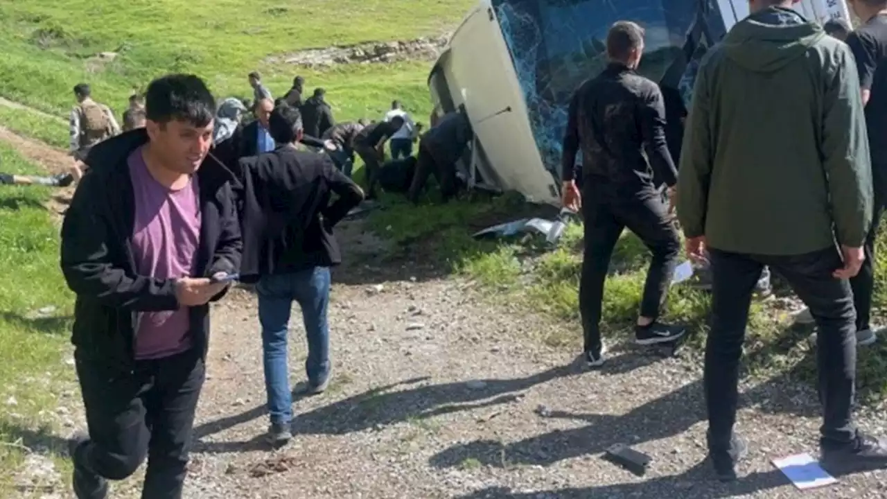 Terrifying moment bus overturns on steep mountain road leaving two dead