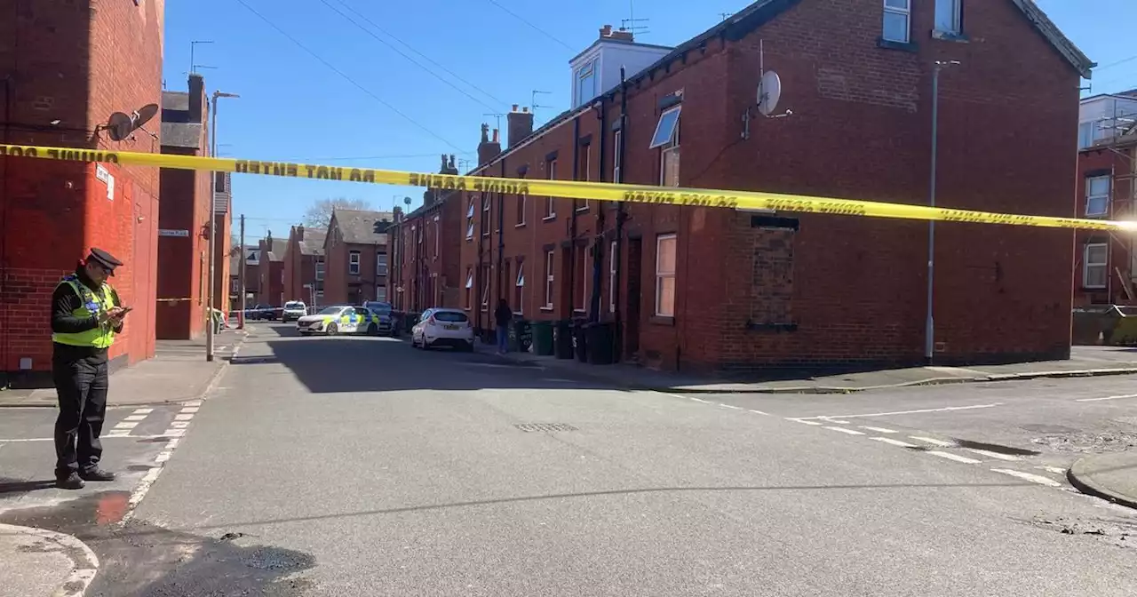 Live as police guard huge cordon in Leeds street with residents 'scared'
