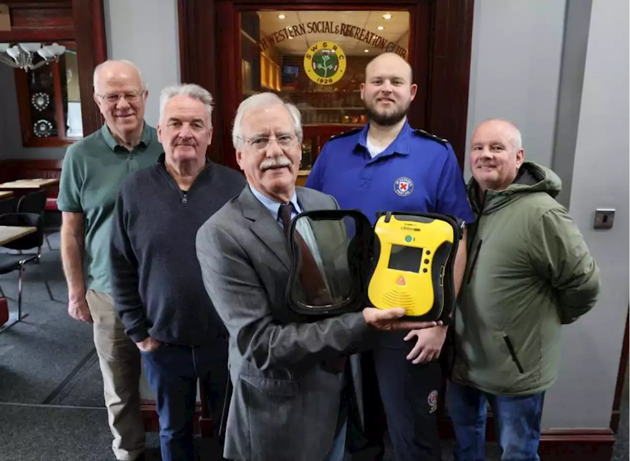 Cardonald social club celebrates arrival of lifesaving defibrillator