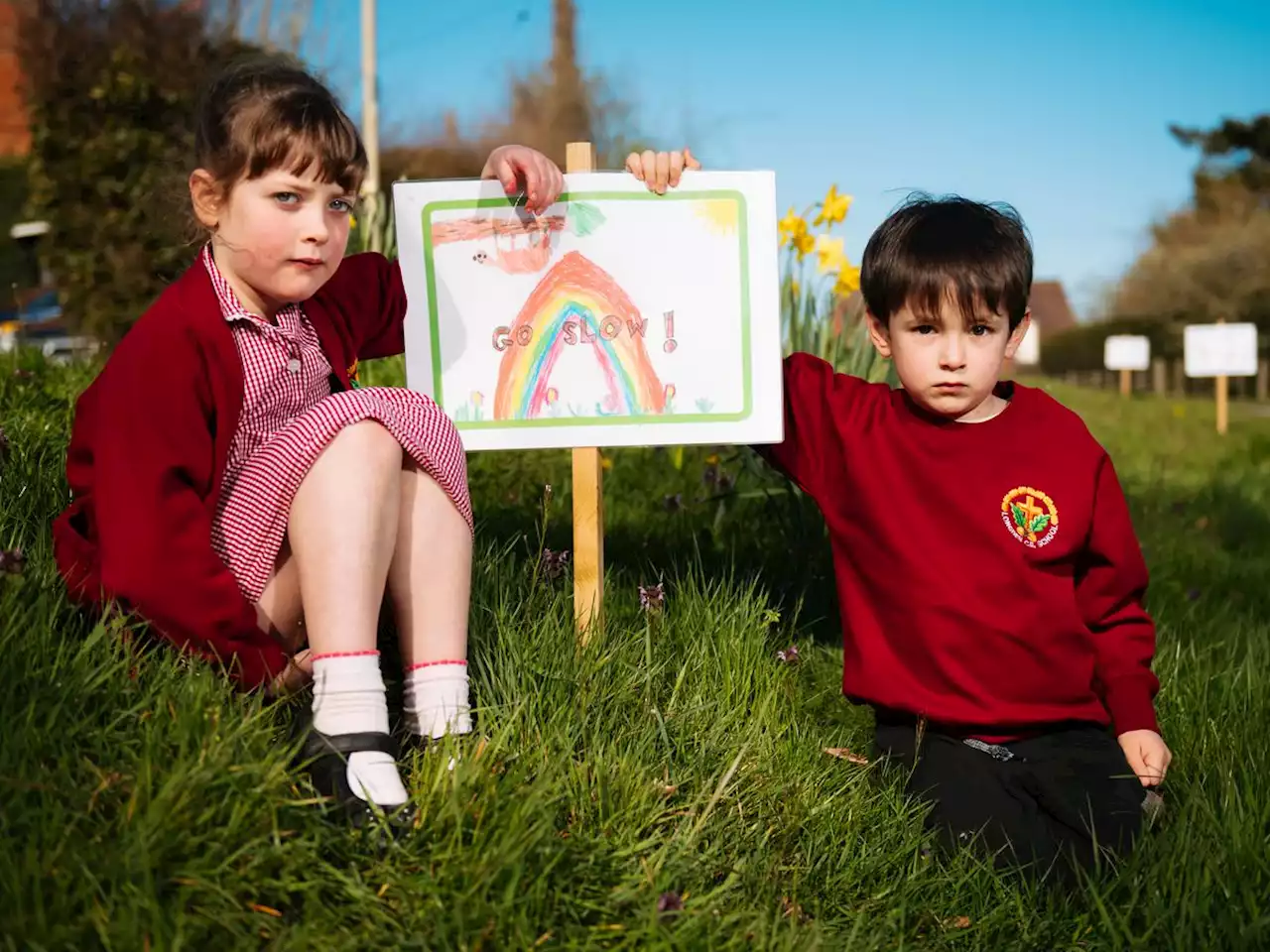 Kids make 'go slow' signs to stop motorists speeding 'before someone gets killed'