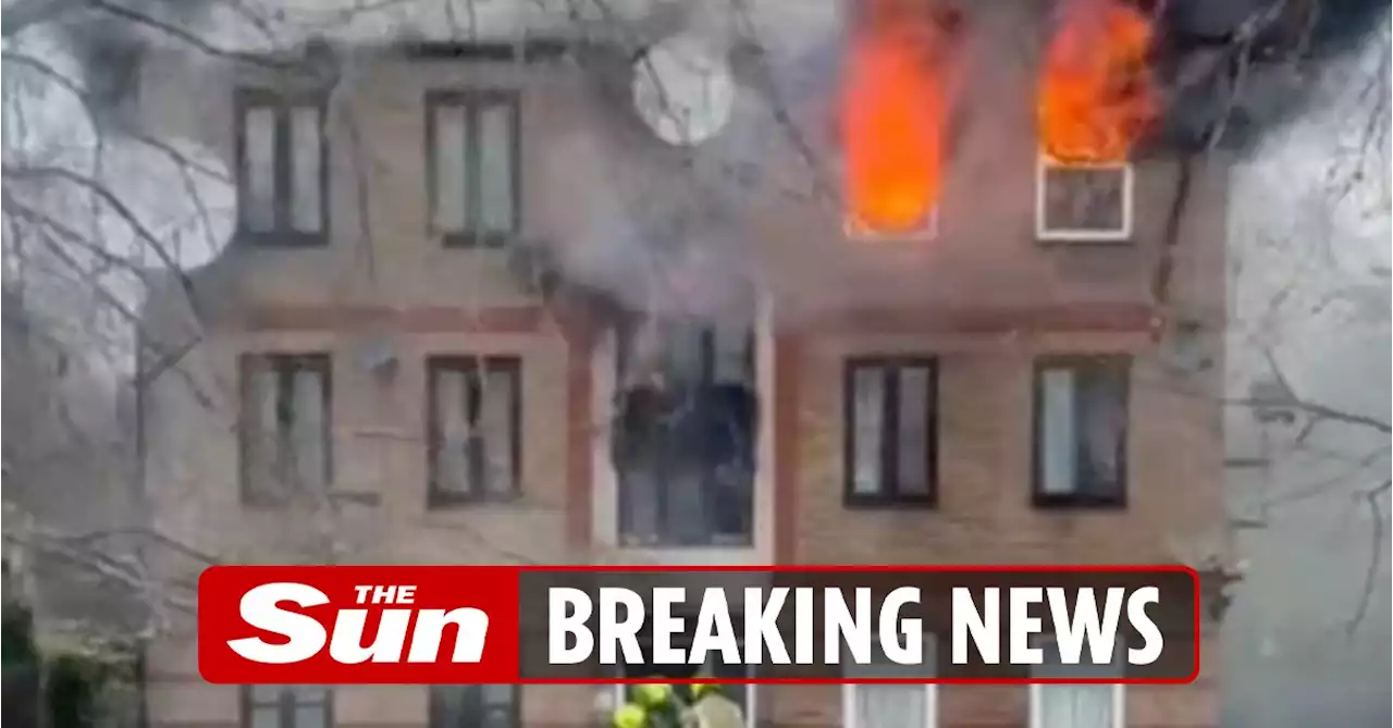 Man killed in huge blaze at block of flats as residents ‘jump from windows’